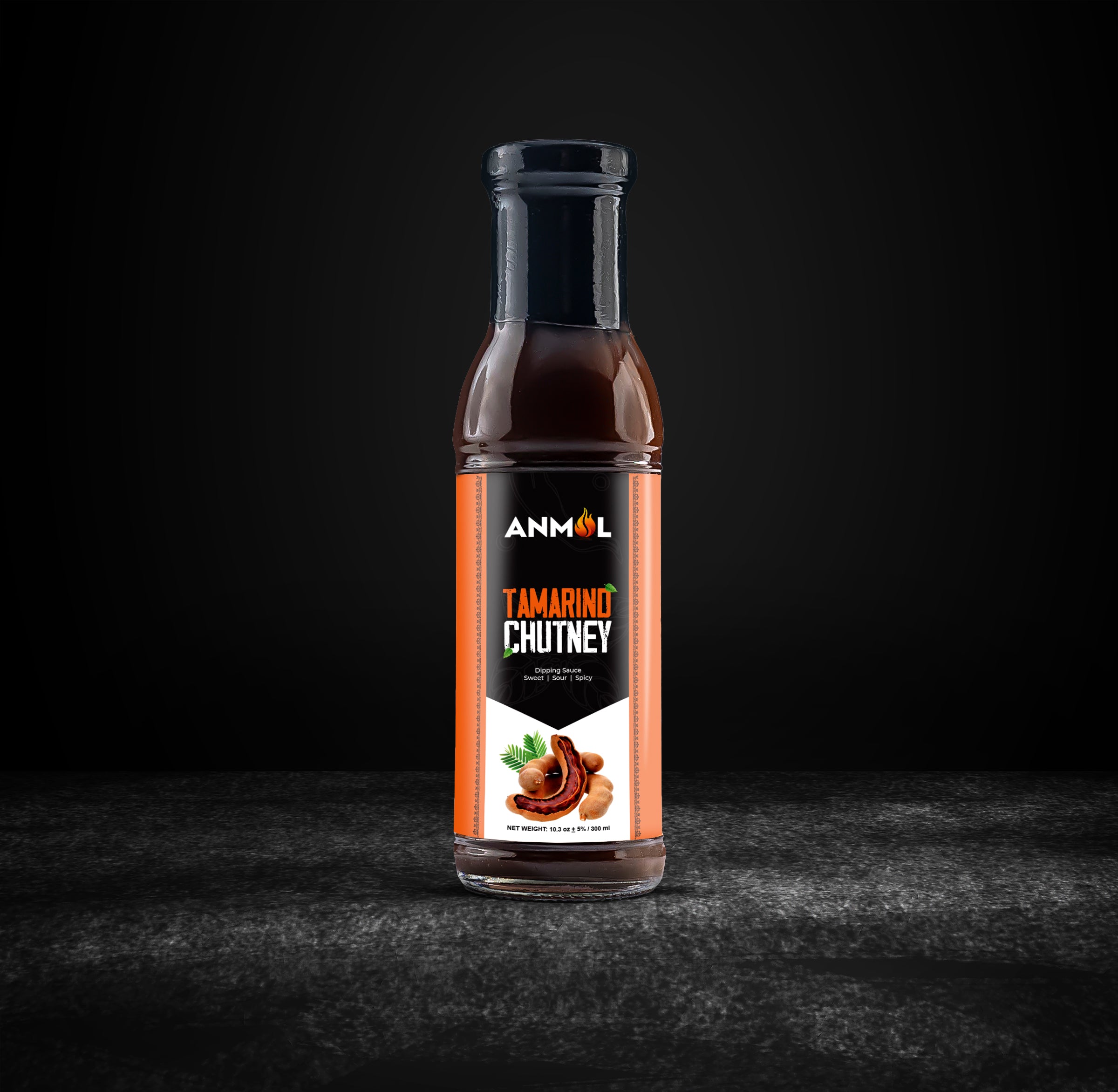 tamarind chutney bottle black background